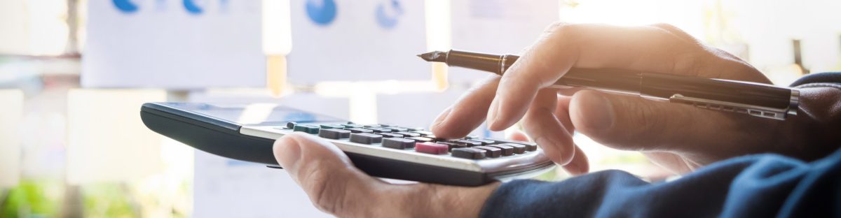 business-finance-man-calculating-budget-numbers-invoices-financial-adviser-working-scaled-e1702307203686-1200x312.jpg